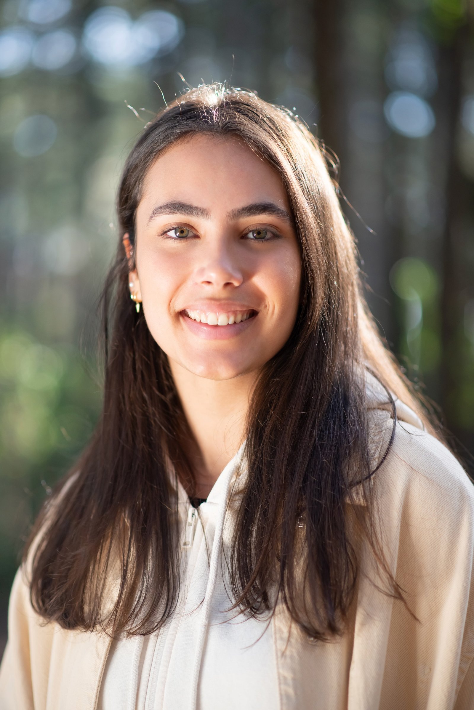 Professional portrait of a young woman with brown hair